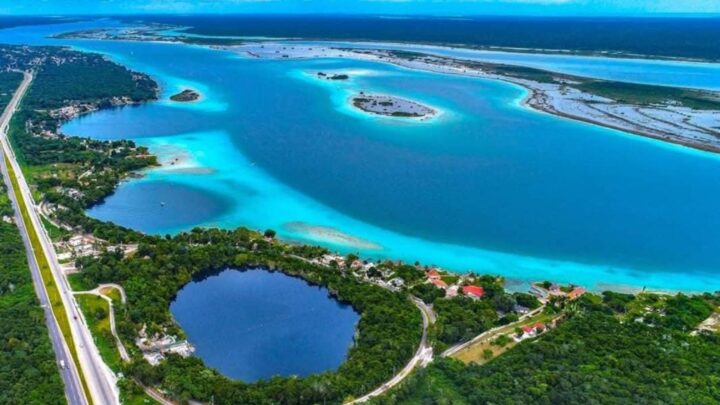 Aerial view of the vibrant lagoons and lush greenery near Tulum, captured during a private tour experience by Carey Tours
