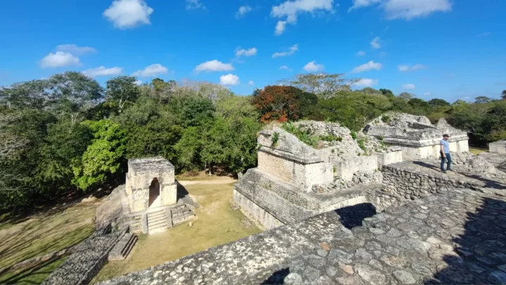 Exploring the ancient ruins surrounded by lush greenery in Tulum on a private tour by Carey Tours.